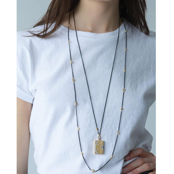 Monica Rich Kosann 47" black steel, gold moon, & star chain necklace - Be On Park