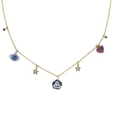 Pippo Perez charm necklace with flower, evil eye, and heart charms